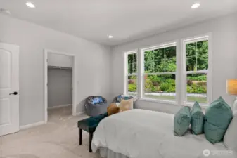 One of several junior bedrooms include a large picture window, new carpets and a walk in closet.