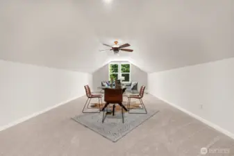 The spacious upper-level bonus room is ideal as a media room or a quiet retreat, thoughtfully set apart from the main living area.