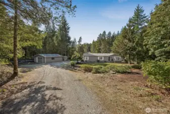 View of the home and detached garage from the driveway.
