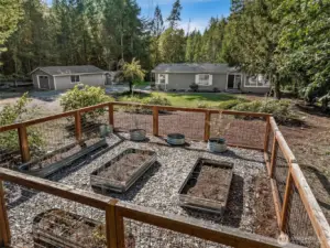 Raised bed garden area in front.
