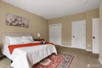 Two closets including a walk in closet