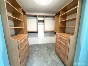 Primary Walk in closet with custom shelving