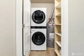 Full sized washer/dryer and storage closet.