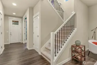 From the front entrance find gleaming engineered floors, recessed lighting and an inviting staircase.