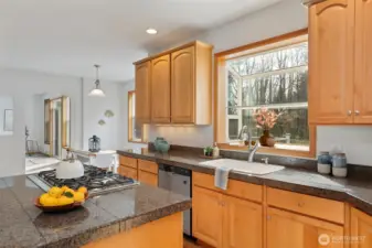 Integrated kitchen design with an adjoining casual dining space.