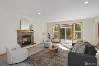 Cozy up in the spacious family room, highlighted by a beautiful slate gas fireplace that creates a warm and welcoming atmosphere.