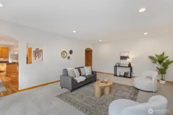 The family room with a smooth transition from the kitchen and offers convenient access to the three-car garage.