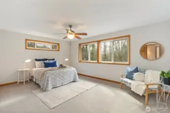 Generously sized, primary suite with a ceiling fan for enhanced comfort.