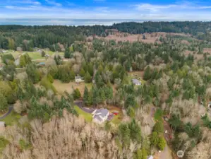 Aerial view showcasing Puget Sound to the north and east of the home. Home located just 3.5 miles from the Kingston Ferry Terminal for easy access to Seattle & Edmonds.
