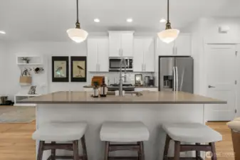 Large kitchen island with seating and quartz countertops