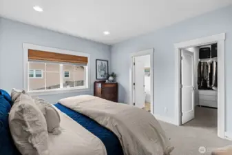 Main-level primary suite filled with natural light