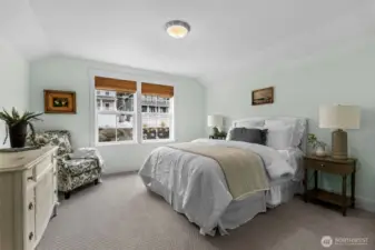 Comfortable guest bedroom with soft natural light
