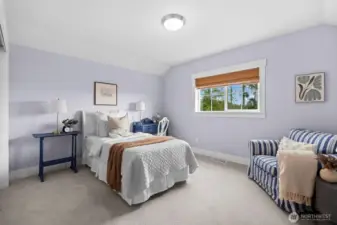 Spacious upper bedroom ideal for guests or office