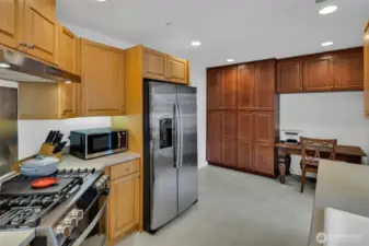 Additional cabinetry includes pantry storage