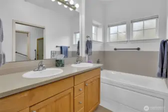 Primary 5-piece bath includes double vanity, jetted tub and step-in shower