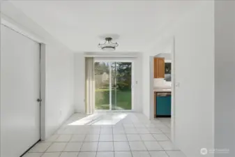 Dining area with access to the backyard and attached one car garage with bonus room.
