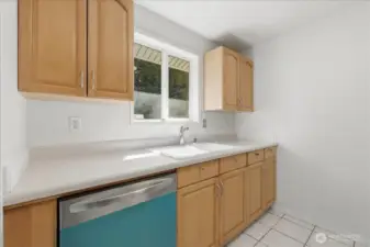 Maple cabinets and vinyl windows!