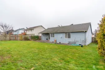 Backyard with gate to front yard.