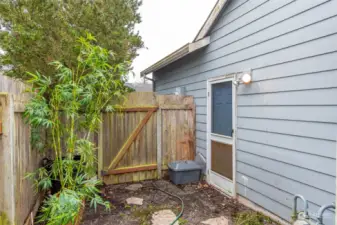 Door to garage and gate to front yard.