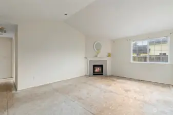 Living room with gas fireplace.