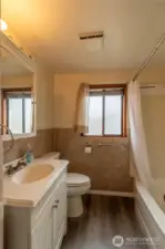 Bathroom with tub and shower.