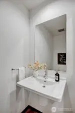 Additionally, there is a powder room for guests.