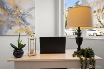 Lower Level- Office, den or extra bedroom (does not have closet, but could be a third bedroom) with beautiful engineered hardwood floors, lots of natural light, beautiful flower garden right outside window; perfect for work from home or relaxing while gaming