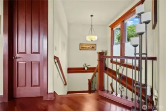 Wide stairs leading to fully finished lower level