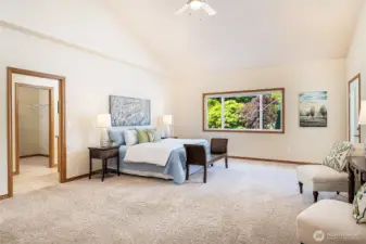 Spacious primary suite with serene views of the backyard and direct deck access. Walk-in closet and en-suite bath just steps away—your private retreat awaits.