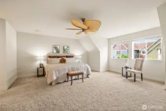 Enormous primary bedroom with ceiling fan.  This room is large - it will easily fit large dressers, armoires, or your favorite bedroom set.
