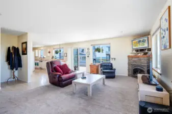 View of living space and sliding glass door out to XL deck with Ocean Views!