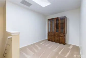 Loft flex room has a skylight for great natural light. Perfect space for crafts, home office, exercise room, playroom, etc.