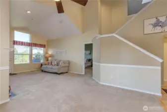 Primary suite is conveniently located on the main floor behind the living room