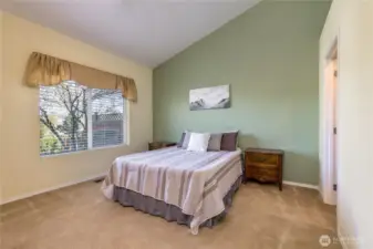 Primary suite with vaulted ceiling
