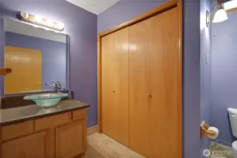 Main floor half bath - laundry behind the doors