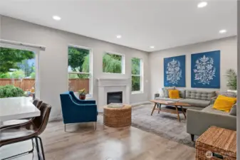 This light-filled living area offers a fireplace, perfect for quiet evenings.