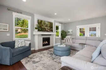 Stunning propane fireplace with TV above. (TV does convey).