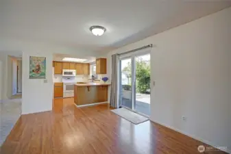 Low maintenance pergo in the kitchen, dining, family room.  Nice slider to back yard patio.