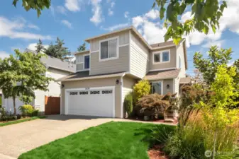 Step into this well-kept, move-in ready 2-story home in Covington WA. To the left of the garage is a beautiful and unique Twisty Baby Tree (a type of locust tree) that the owner planted and cared for!