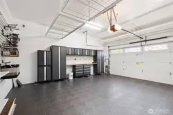 Amazing garage! From the interlocking vinyl flooring to the cabinets to the installed organizer systems--everything runs with the house sale!!