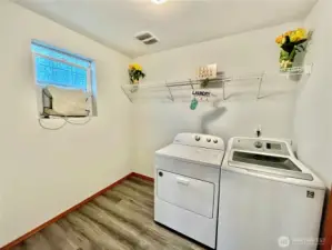 Main floor Roomy Laundry room with door going to garage