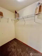 Primary bedroom walk in closet