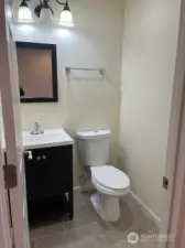 Main level bathroom convenienntly located with the kitchen and living area.