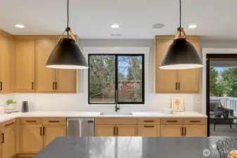 WOW! This kitchen is both beautiful and practical. Wide aisles, high end appliances, tasteful fixtures and walk in pantry.