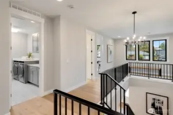 Upstairs open landing with wide staircase and wonderful light.