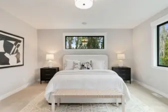 Generously sized primary bedroom overlooking the backyard.