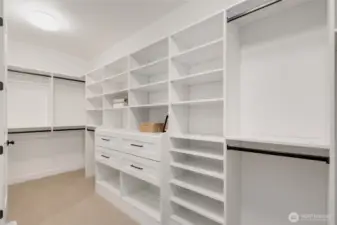 Primary walk-in closet with built-ins