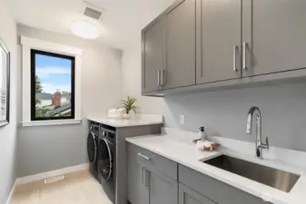 Spacious and practical upper floor laundry room.