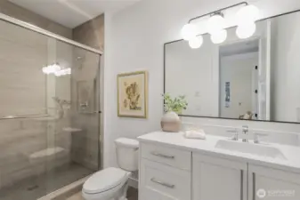 Lower level bathroom adjacent to the 5th bedroom.