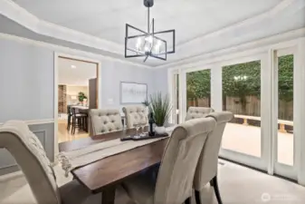 Formal dining with French door access to beautiful wraparound deck.